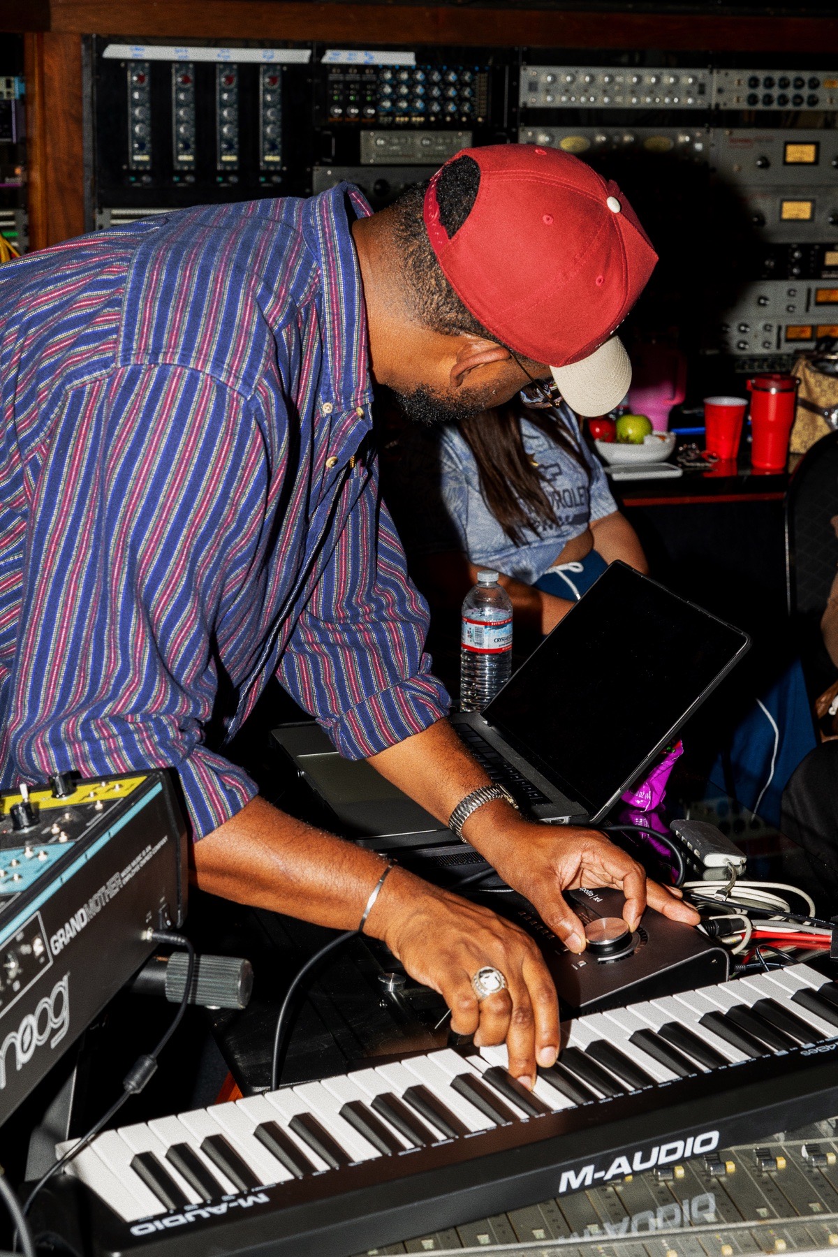 A producer shaping a track at the keyboard