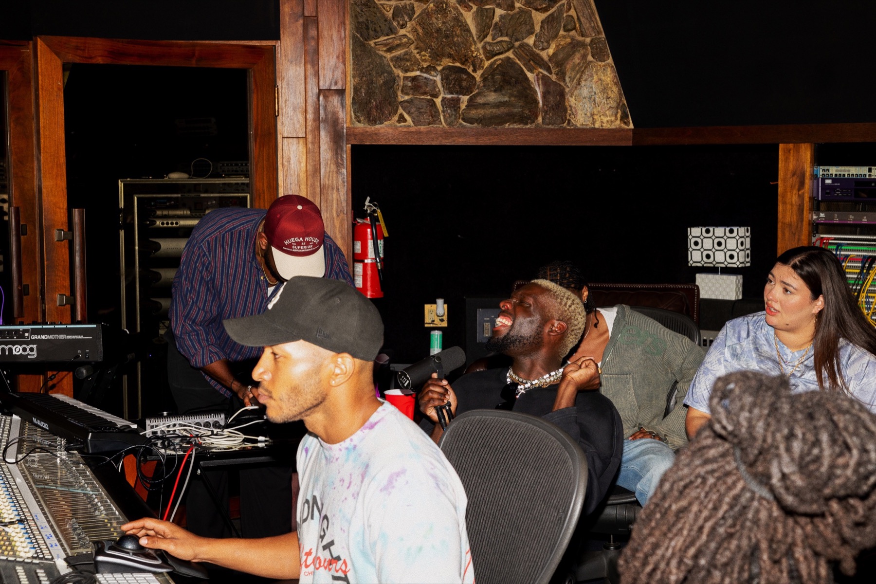 Artists and producers gathered around the console during a BLANC session